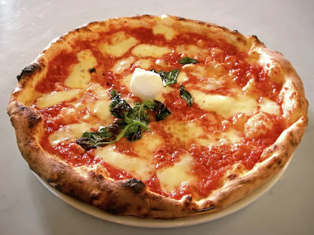 Margherita pizza with tomato, mozzarella, and basil