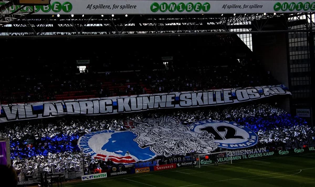 Football fans display large tifo with lion and number 12 at stadium