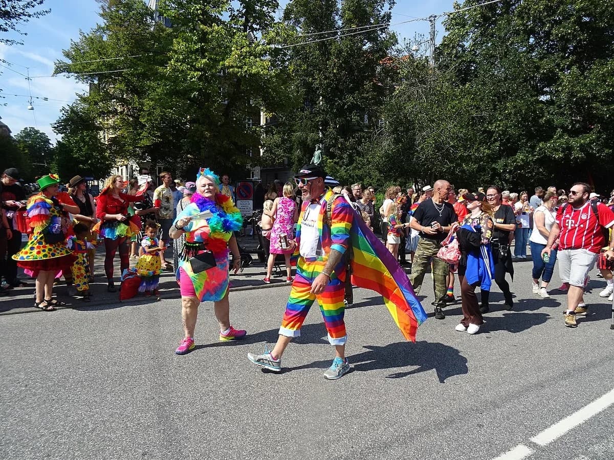 People dressed in rainbow-themed clothing at Copenhagen Pride parade