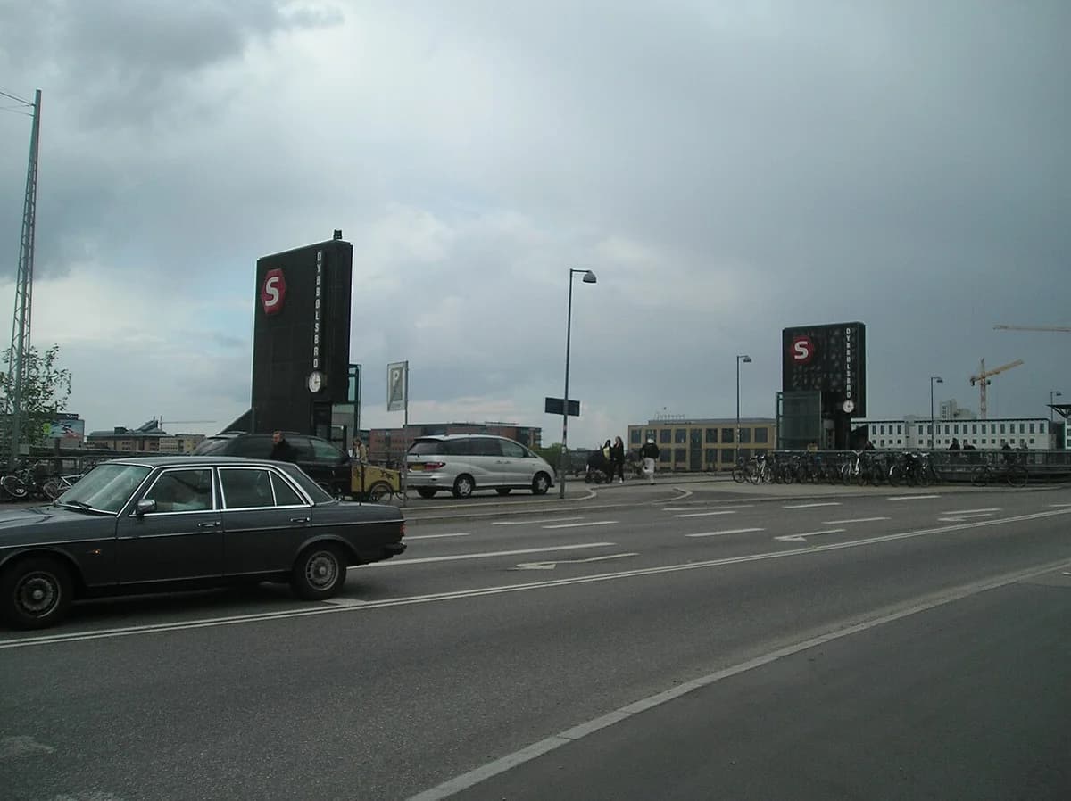 Exterior view of Dybbølsbro Station in Copenhagen beside a road.