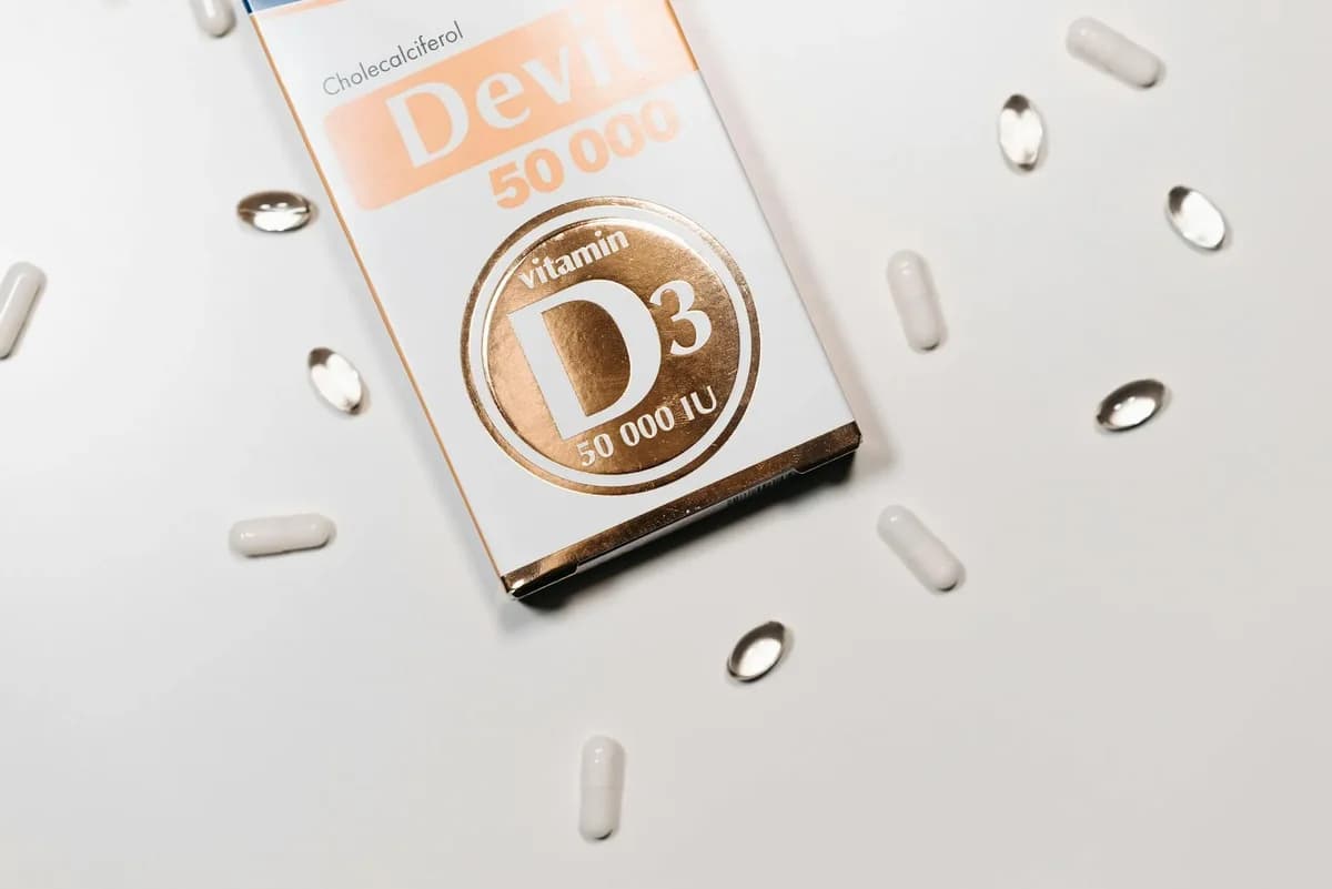 Vitamin D3 supplement box with capsules on light surface