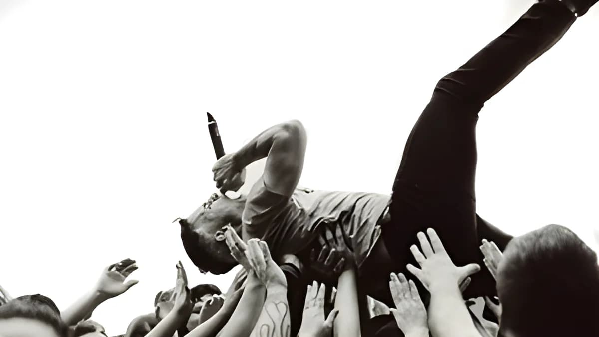singer crowd surfing at a live music event