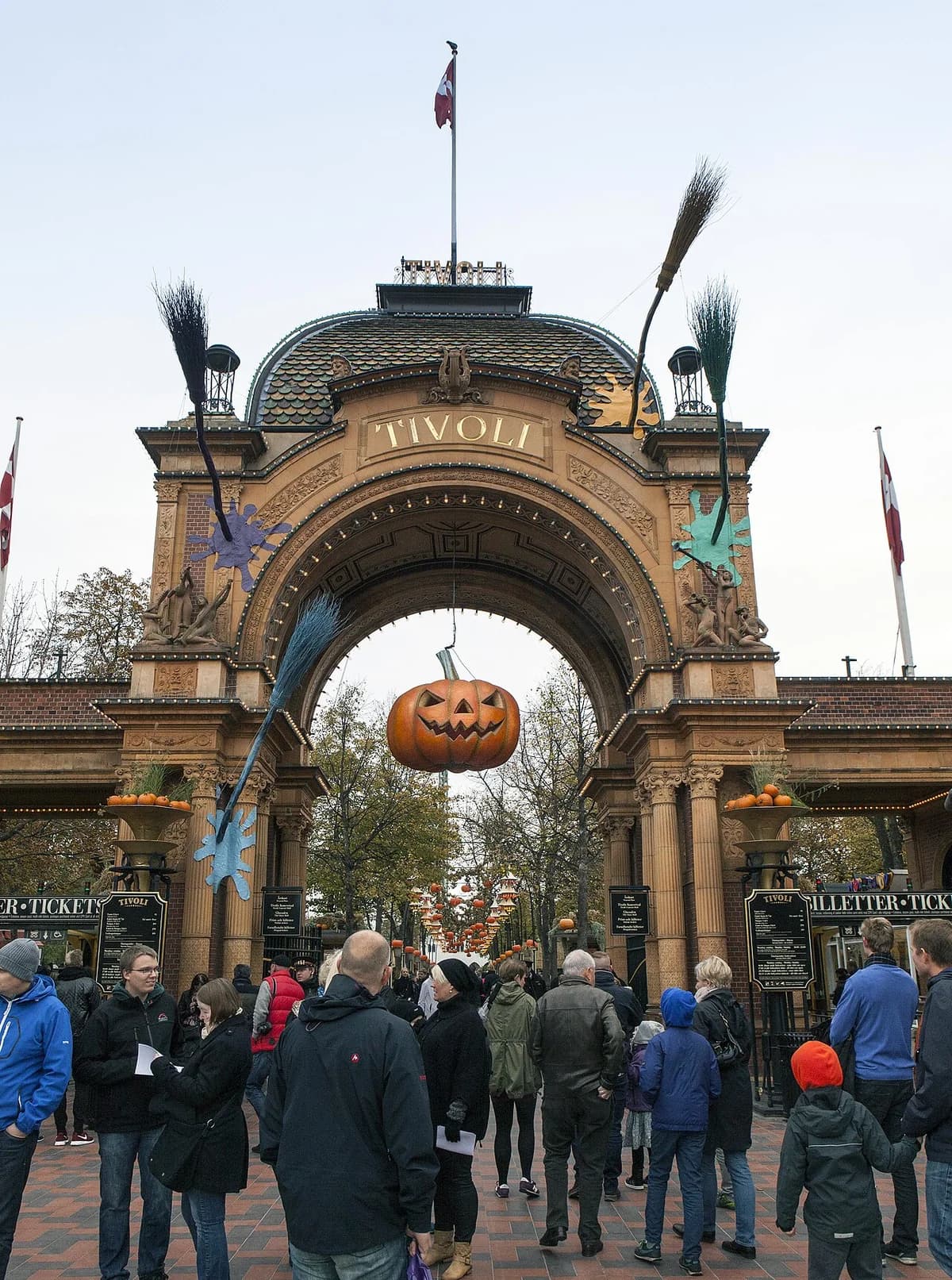 People entering the Halloween-decorated Tivoli Gardens entrance in Copenhagen.